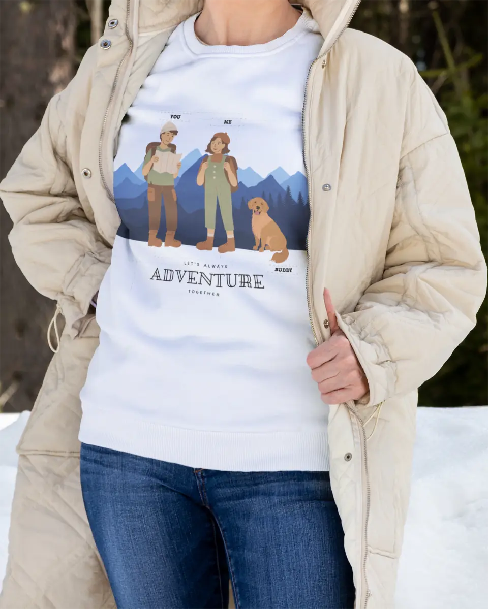 Woman wearing personalized sweatshirt with hiking design two people and a dog